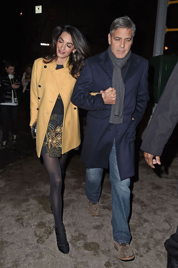 George-Clooney-and-wife-Amal-hold-hands-as-they-walk-back-to-their-hotel (1)