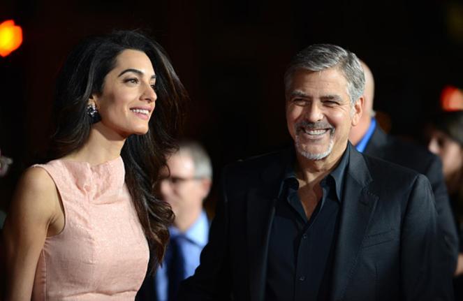 HOLLYWOOD, CA - OCTOBER 26: Attorney Amal Alamuddin and actor/producer George Clooney arrive for the Premiere Of Warner Bros. Pictures' 