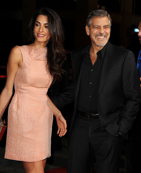 HOLLYWOOD, CA - OCTOBER 26: Amal Clooney and George Clooney attend the premiere of 