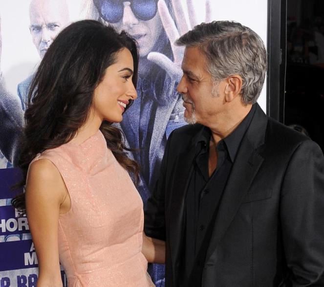 HOLLYWOOD, CA - OCTOBER 26: Actor George Clooney and wife Amal Clooney arrive at the premiere of Warner Bros. Pictures' 