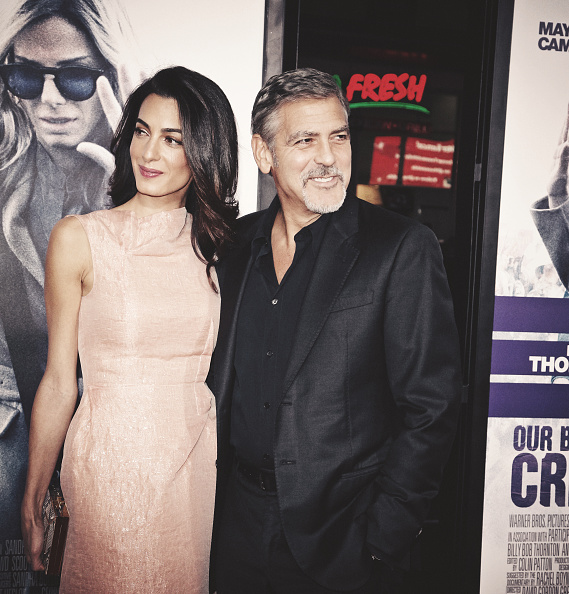 HOLLYWOOD, CA - OCTOBER 26: (Editors Note: This image has been processed using digital filters) Amal Alamuddin (L) and actor George Clooney attend the premiere of Warner Bros. Pictures' 'Our Brand Is Crisis' at TCL Chinese Theatre on October 26, 2015 in Hollywood, California. (Photo by Tibrina Hobson/Getty Images)