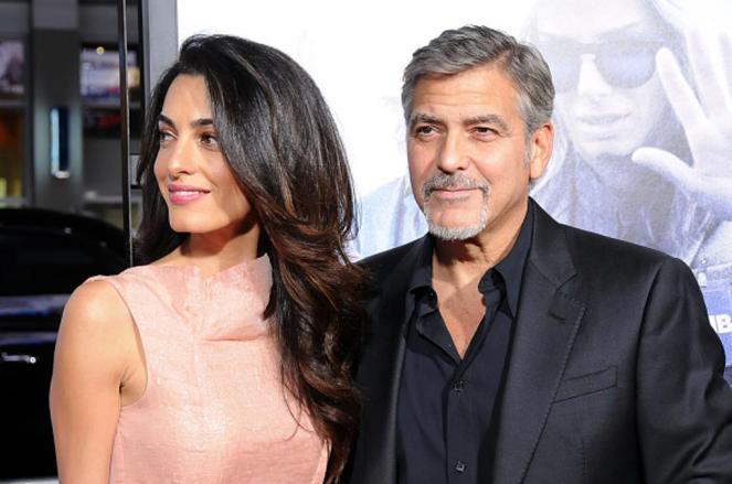 HOLLYWOOD, CA - OCTOBER 26: (L-R) Lawyer Amal Alamuddin Clooney and actor/producer George Clooney arrive at the Premiere of Warner Bros. Pictures' 'Our Brand Is Crisis' at TCL Chinese Theatre on October 26, 2015 in Hollywood, California. (Photo by Barry King/Getty Images)