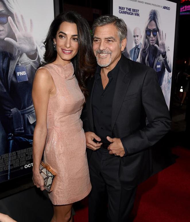 HOLLYWOOD, CA - OCTOBER 26: Amal Alamuddin (L) and actor George Clooney attend the premiere of Warner Bros. Pictures' 