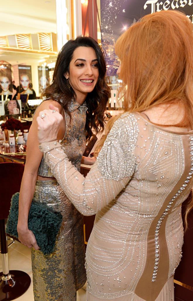 LONDON, ENGLAND - DECEMBER 03: Amal Clooney (L) and Charlotte Tilbury attend Charlotte Tilbury's naughty Christmas party celebrating the launch of Charlotte's new flagship beauty boutique in Covent Garden on December 3, 2015 in London, England. (Photo by David M. Benett/Dave Benett/Getty Images for Charlotte Tilbury)